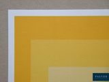an image of a piece of paper with a yellow and white square on it