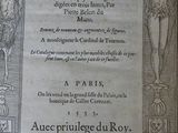 an old book with a picture of a man on a cross on it