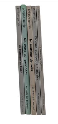 four books that are stacked on top of each other