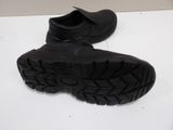 a pair of black shoes that are on a table