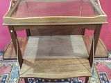 a small table with a glass top on a rug