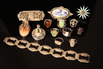 a lot of different rings and bracelets on a table