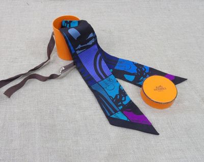 purple and blue neck tie with a black and purple design