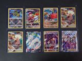 beaucoup de cartes pokemon différentes sur la table