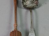 two spoons and a spatula on a table