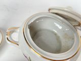 a close up of a bowl with a lid on a table