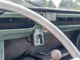 a close up of a dashboard and steering wheel of a car