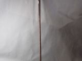 an old cane with a wooden handle on a white background