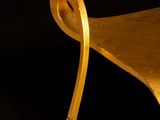 an image of a wooden chair on a black background