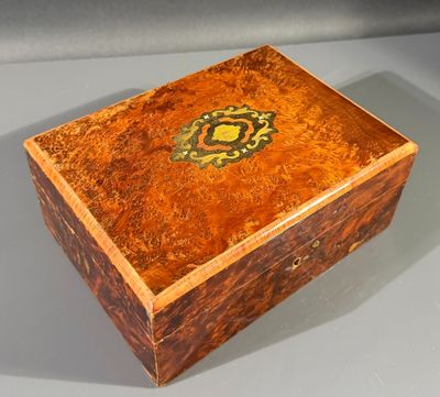 an image of a wooden box with a decorative design on it