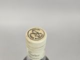 a bottle of wine that is sitting on a table