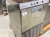 a stainless steel dishwasher sitting on a pallet in a warehouse