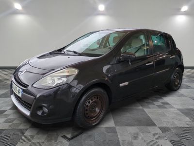 a picture of a small black car parked in a garage