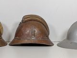 three helmets that are sitting on a table