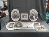 a table that has a bunch of old photos on it