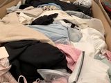 many boxes of clothes that are in a store