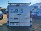 a white van that is parked in the grass