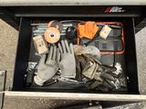 a tool box with gloves, gloves, and other items in it