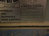 a label on the back of a machine that is sitting on the floor