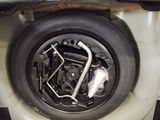a close up of a tire on the side of a car