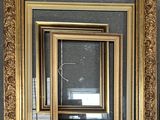 a picture of a gold framed mirror on the wall