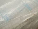 a plastic bag with a toothbrush inside of it