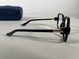 the glasses are on the table next to a roll of toilet paper