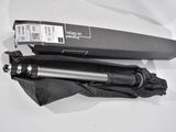 a black umbrella sitting on top of a white table