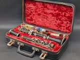 a case with a clarinet inside of it on a table