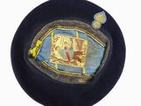 a blue hat with a picture of a man in a boat on it