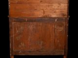 a wooden bed with a wooden headboard and foot board