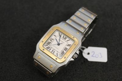 an image of a silver and gold wrist watch with a price tag