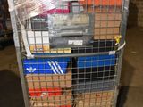 a metal cart with a bunch of boxes on top of it