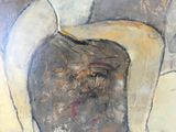 a painting of a man ' s face on the wall
