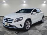a white mercedes gla suv parked on a checkered floor