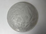 a picture of a white plate on a white table