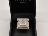 a close up of a ring in a black box on a white background