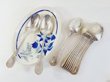 a plate with spoons and spoons on it next to a plate with spoons on it