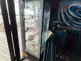 a glass door that is open in a restaurant