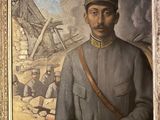 painting of a man in a military uniform standing in front of a pile of rubble