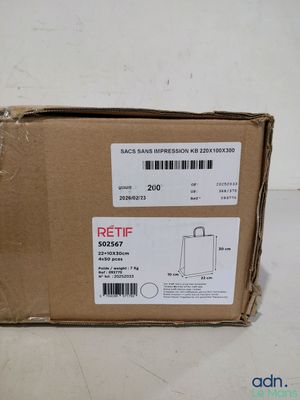 packaging of a box with a sticker on it sitting on a table