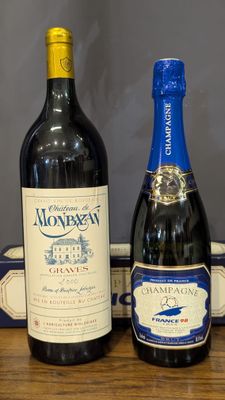 three bottles of wine sitting on a table next to a box of wine