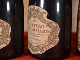 three bottles of wine that are sitting on a table