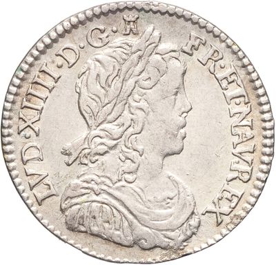 une pièce d'argent sur laquelle figure le buste d'une femme