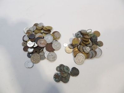 a lot of coins that are on the table