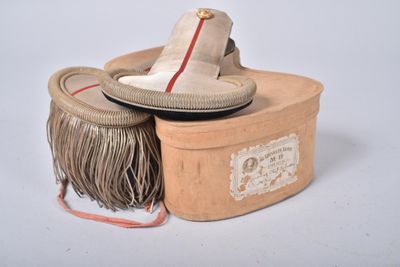 a small box with a pair of shoes on top of it