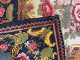 a close up view of a rug with a pair of shoes on it