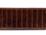 the brown alligator skin wallet is open and ready to be used