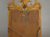 a wooden frame with a green string attached to it