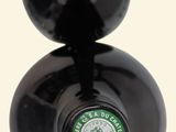two bottles of wine sitting on top of each other